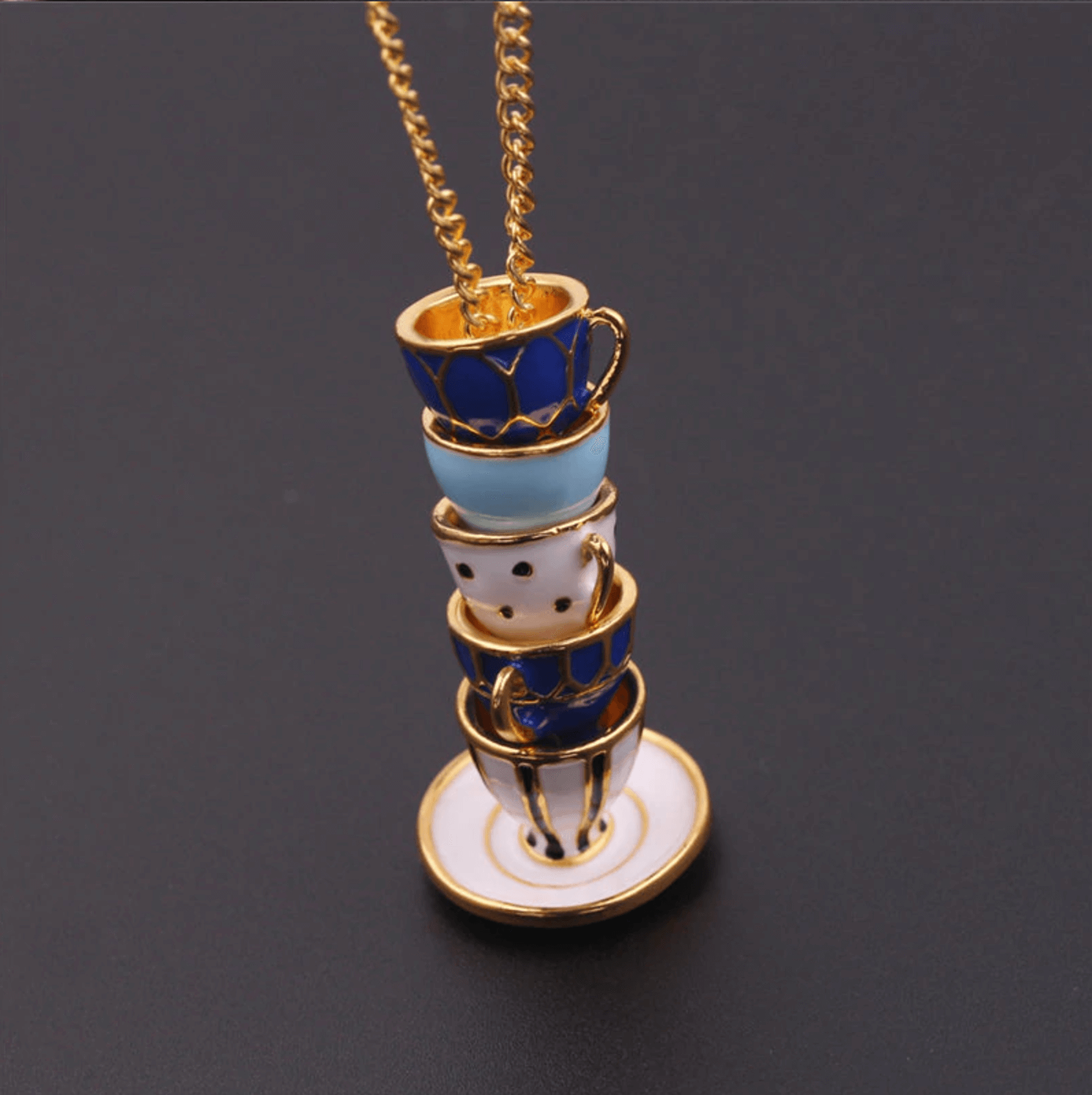 https://www.lovetrendify.com/cdn/shop/products/Alice_in_Wonderland_Necklace_with_Teacups_2000x.png?v=1568704287
